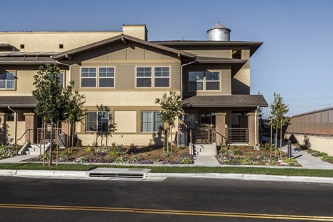 A modern house with a well-maintained front yard.
