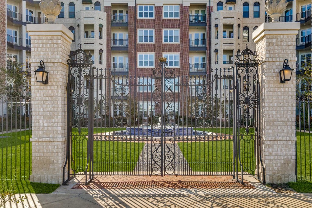a wrought iron gate in front of an apartment building