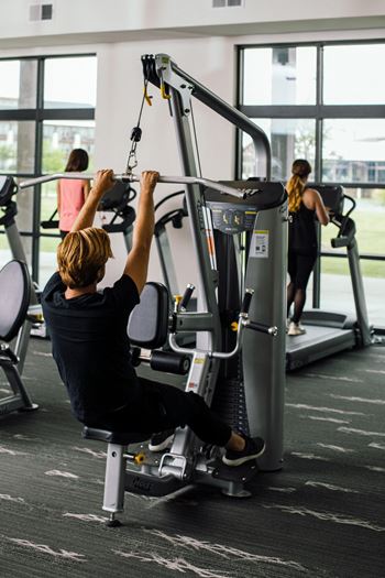 24-Hour Fitness Center with A View Of The Pool and Lake