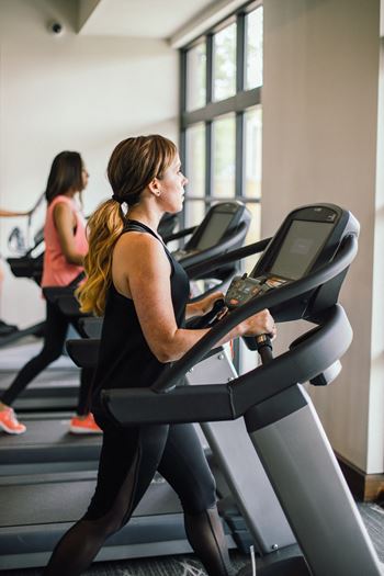 24-Hour Fitness Center with A View Of The Pool and Lake