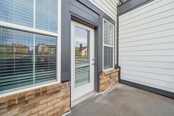 the front porch of a home with windows and a door at Plat 4 at Research Triangle, Durham