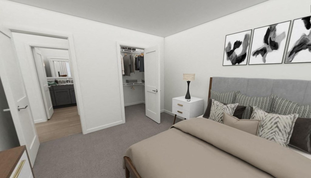 a bedroom with a bed and a nightstand with a lamp