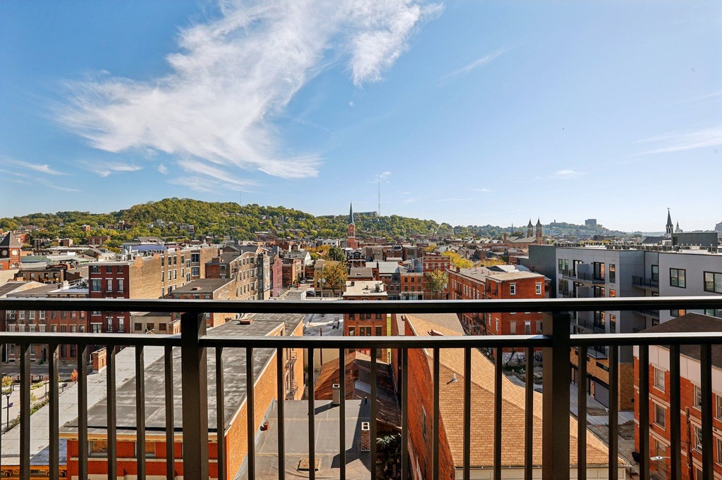 A cityscape viewed from a balcony.