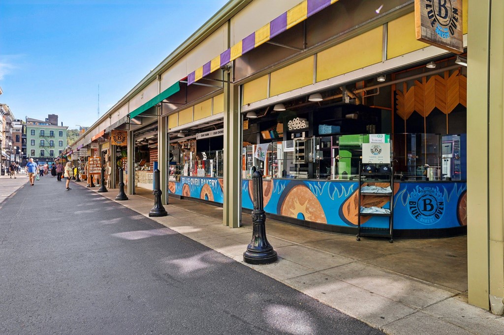 Vibrant Findlay Market in Over-the-Rhine Cincinnati featuring Blue Oven Bakery and local artisan vendors near Contrast OTR.