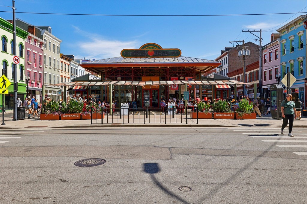 Findlay Market entrance and Bunnyâ€™s Plaza in Over-the-Rhine Cincinnati surrounded by colorful historic buildings near Contrast OTR.