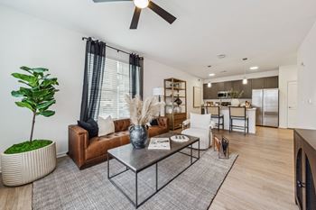 a living room with a couch and a coffee table  at Plat 4 at Research Triangle, Durham, 27703