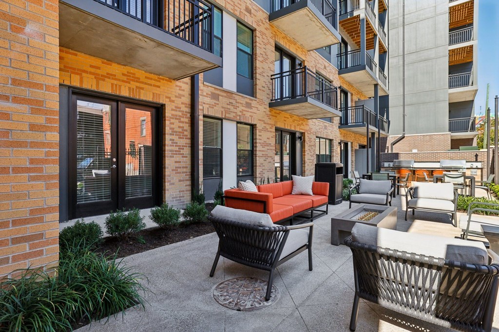 Private balcony at Contrast OTR offering TQL Stadium views and modern black metal railings overlooking Cincinnati.