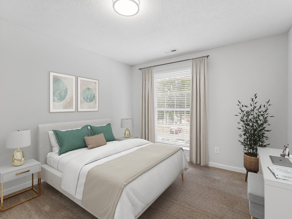 a bedroom with a white bed and green pillows