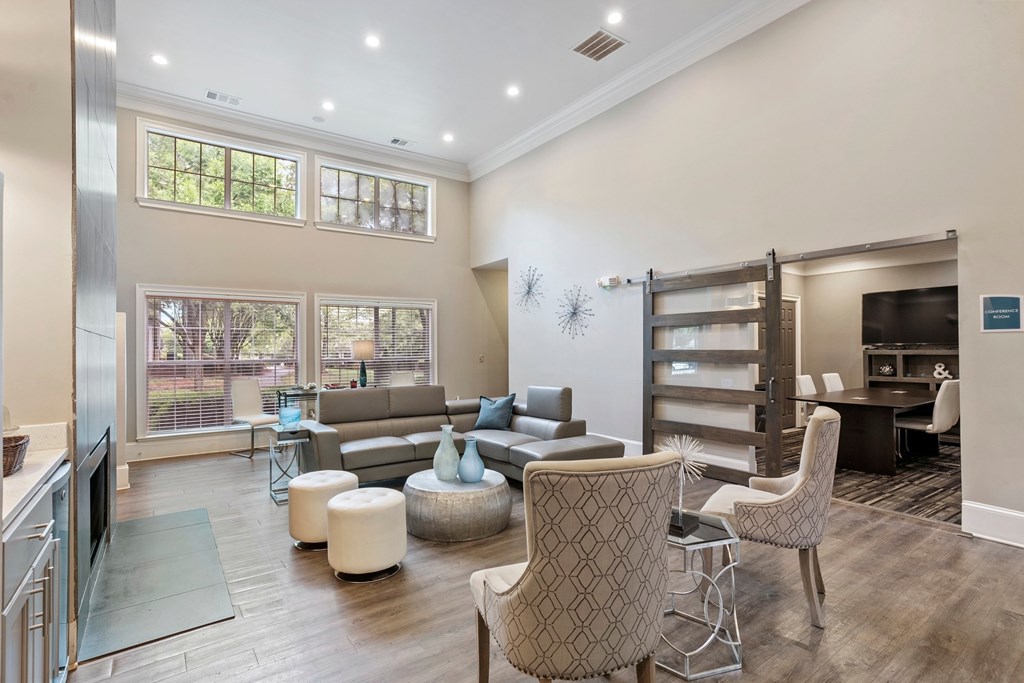 Contemporary clubhouse lounge with fireplace and gathering area in Conyers, GA apartments.