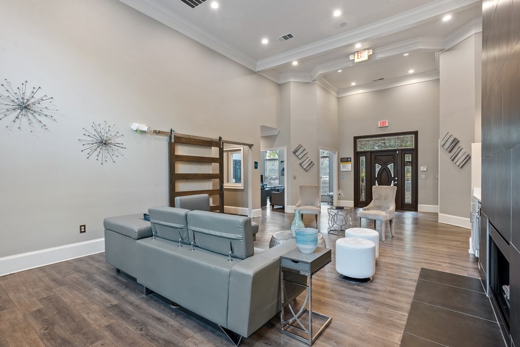 Open clubhouse seating area with natural light and modern décor at Village at Almand Creek.