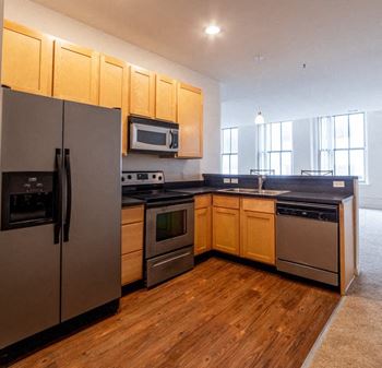 Fully Equipped Kitchen Includes Frost-Free Refrigerator, Electric Range, & Dishwasher at 26 West, Managed by Buckingham Urban Living, Indiana, 46204