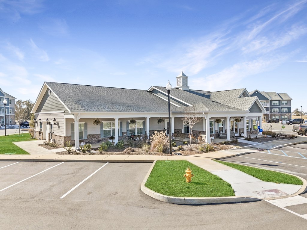 A building with a parking lot in front of it.