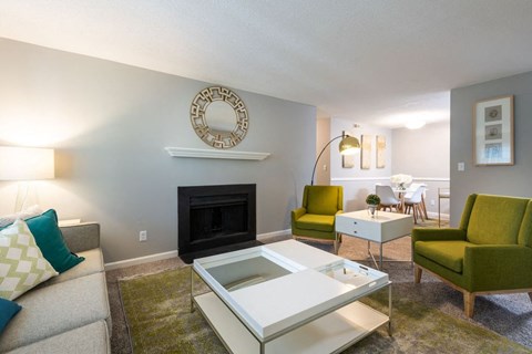 a living room with a couch and a fireplace