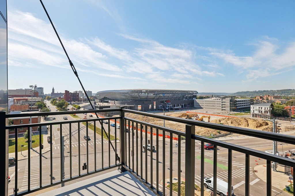 Private balcony at Contrast OTR apartments in Cincinnati, OH with sleek glass doors and city views.
