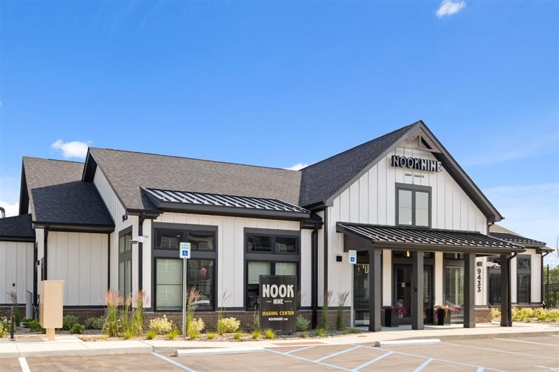 Nook Nine leasing center with black trim and farmhouse design