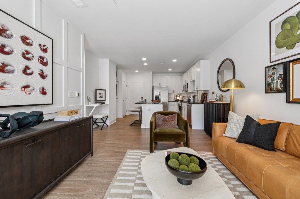 Bright apartment living room at Contrast OTR in Over-the-Rhine, Cincinnati with modern furniture, floor-to-ceiling art, and urban-style design.