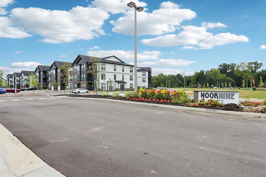 Exterior of Nook Nine Apartments with landscaped entry on Far Northside Indianapolis