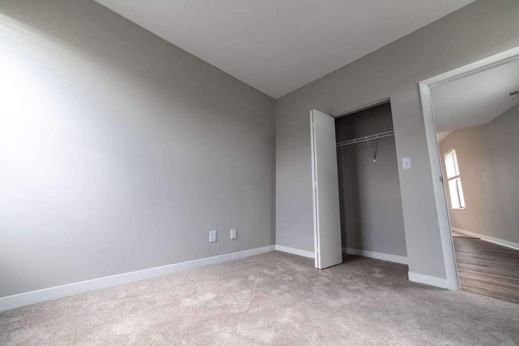 Bedroom with natural light from windows and large closets at The Argyle on Mass Ave, Indiana, 46202