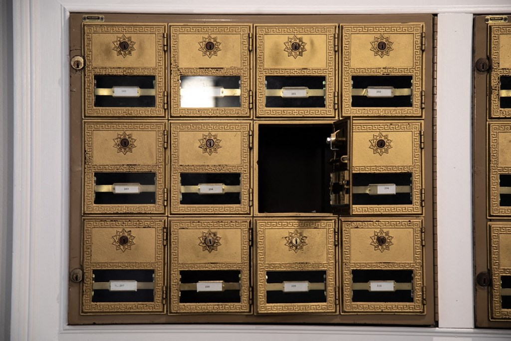 Communal mailbox areas with one box open at The Argyle on Mass Ave, Indiana, 46202