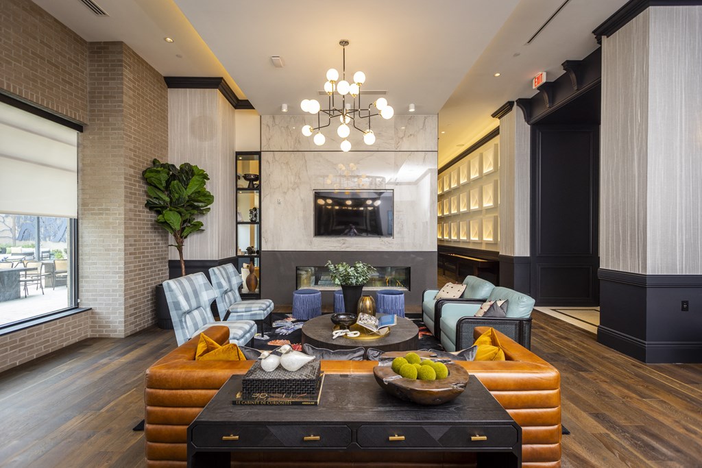 a living room filled with furniture and a large window