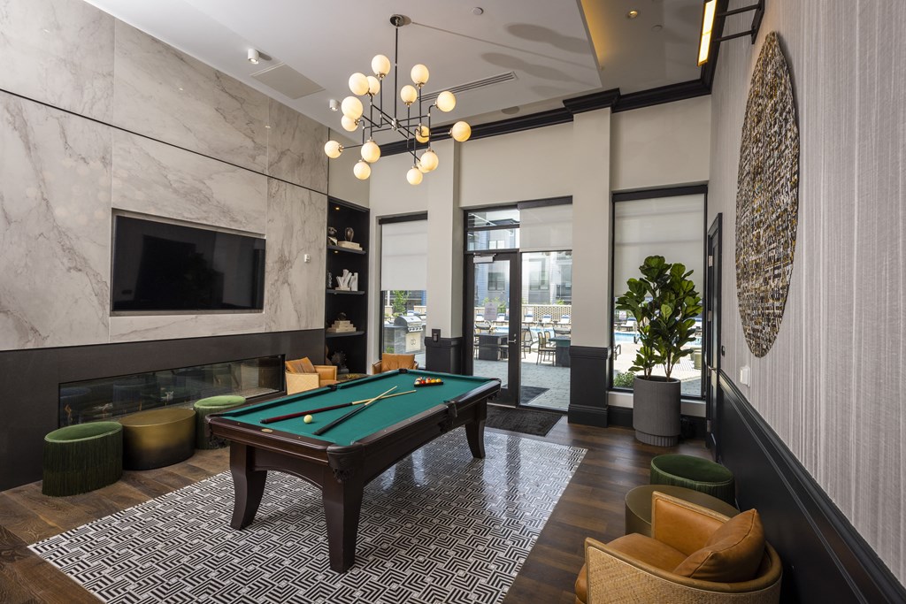 a pool table in a lobby of a hotel