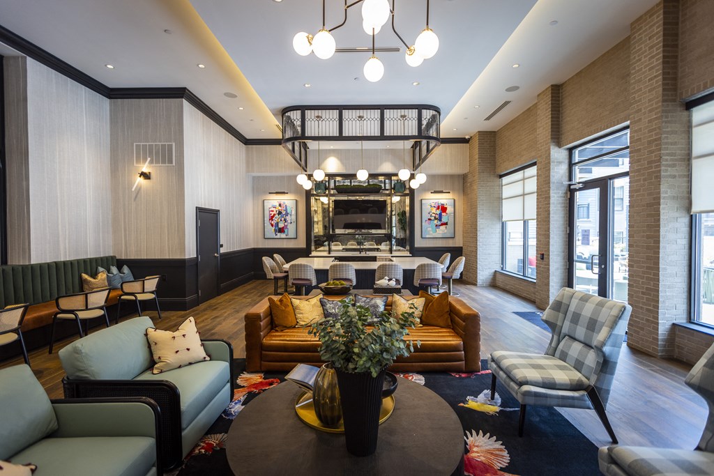 a living room filled with furniture and a large window