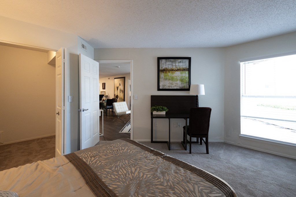 a view of a living room and a dining room with a rug