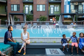 Outdoor gathering spot in front of infinity pool with benches, fire pits, grills and more - Photo Gallery 44