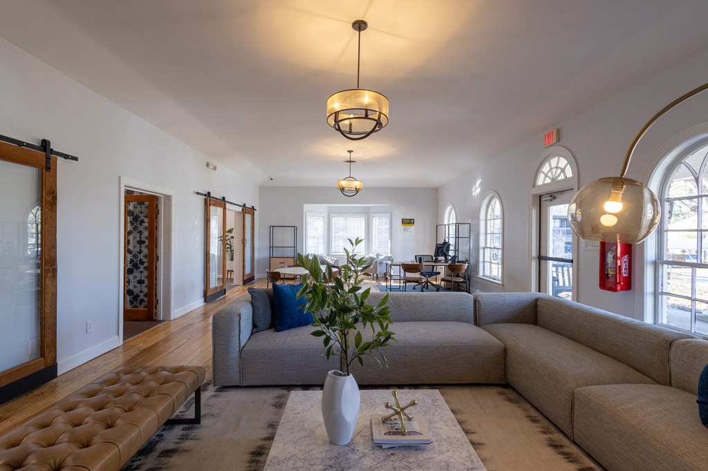 a living room with a couch and a rug