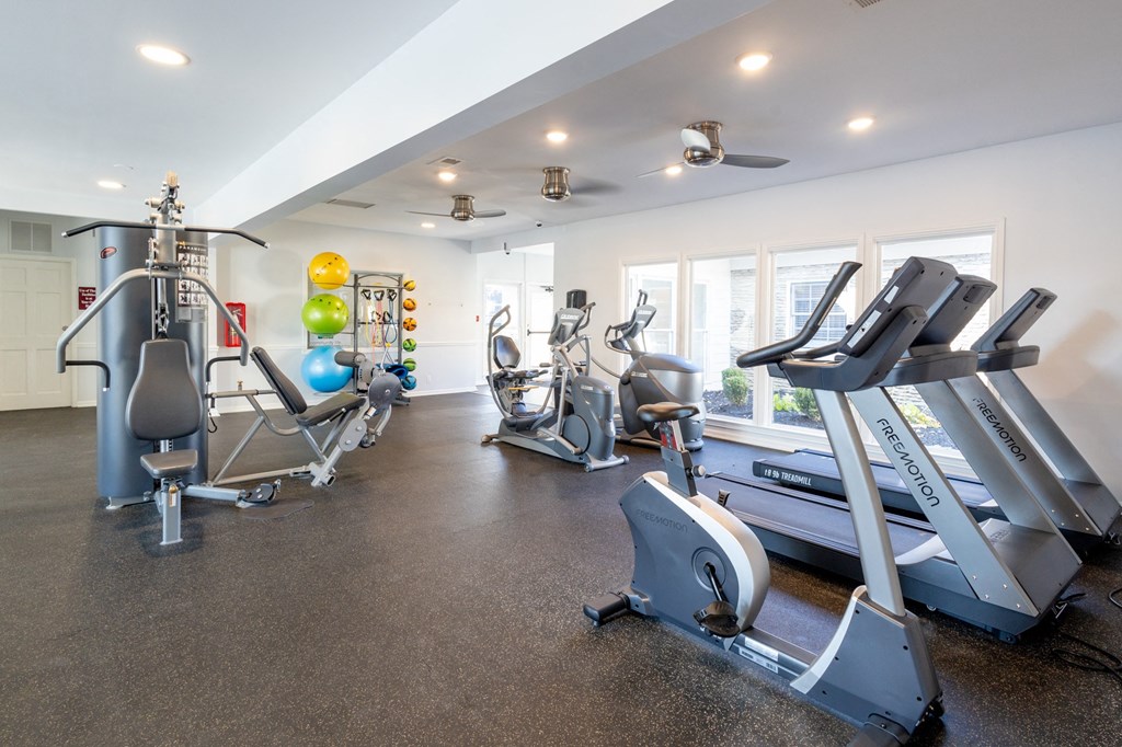 the gym with treadmills and other exercise equipment at the flats at chev