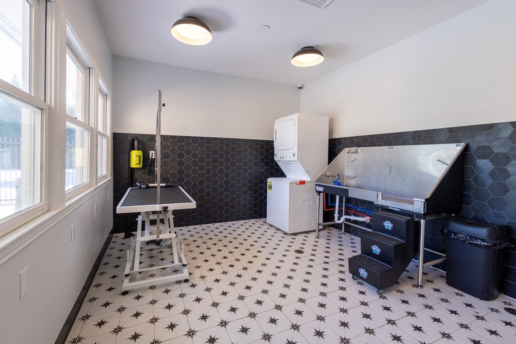 a kitchen with a sink and a refrigerator and a table