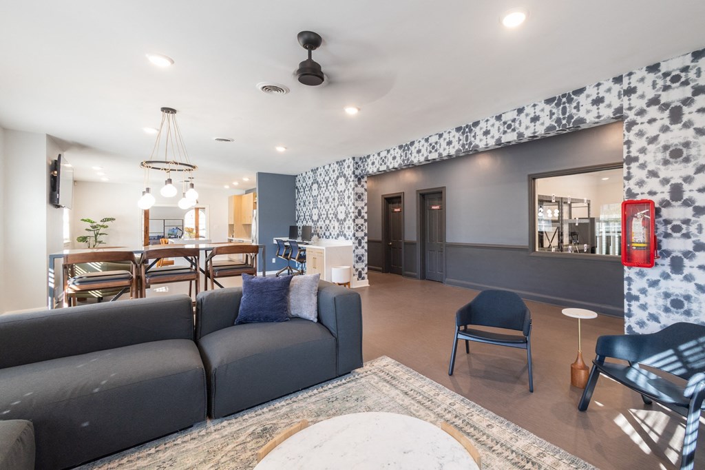 a living room and dining room with a couch and a table