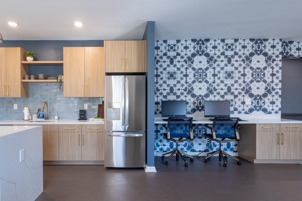 a conference room with chairs and a table and a refrigerator