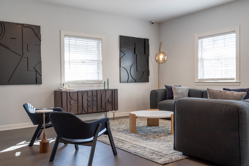 a living room with a couch and a table and chairs