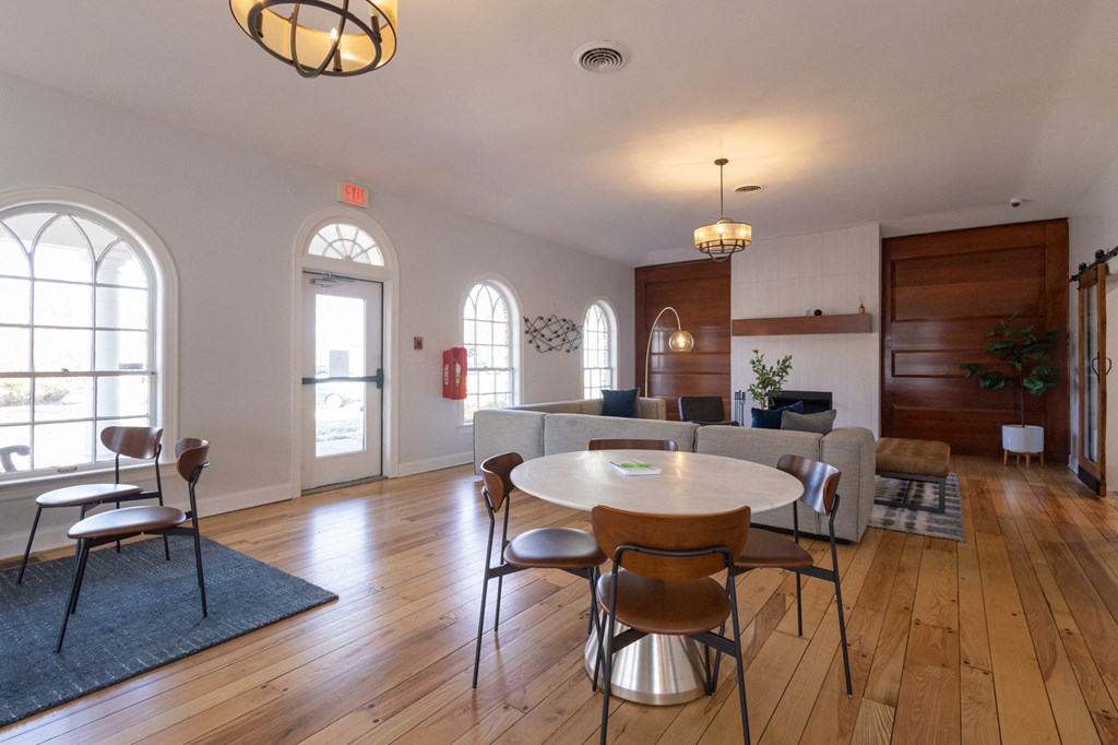 an open living room and dining room with a table and chairs