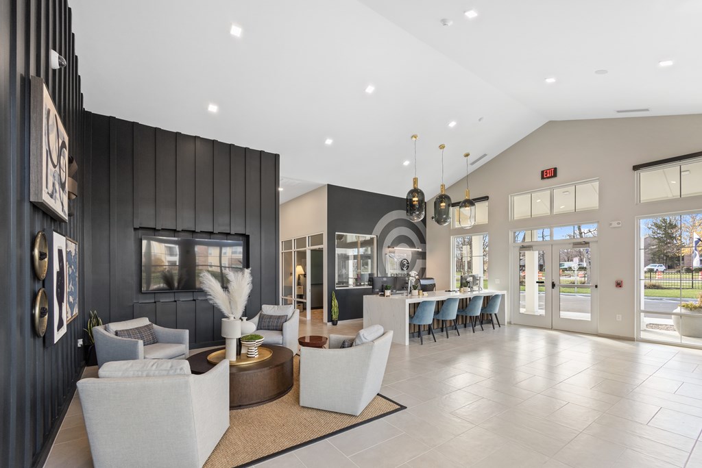 A spacious lobby with a reception desk and seating area.