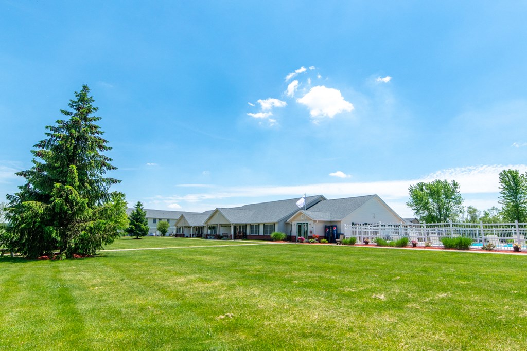 a house with a large lawn in front of it