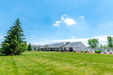 a house with a large lawn in front of it
