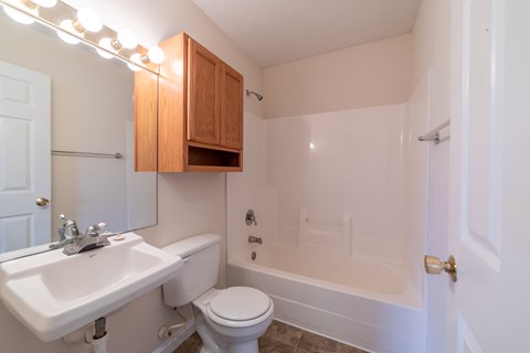 a bathroom with a sink toilet and bathtub