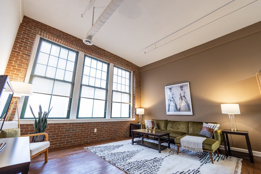 Living Room With Expansive Window at Harness Factory Lofts and Apartments, Indianapolis, IN