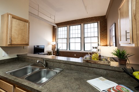 a kitchen with a sink and a window