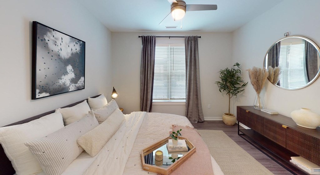 a bedroom with a large bed and a window