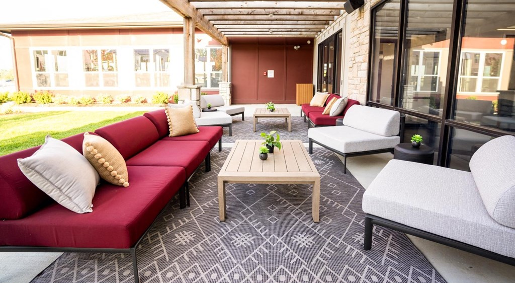 a patio with couches and a coffee table