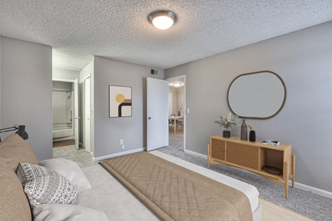 A living room with a couch and a wooden shelf.