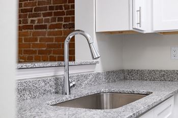 Stainless Steel Sink With Faucet In Kitchen at Lockerbie Court on Mass Ave, Indiana, 46204