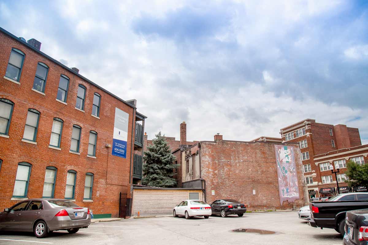 Apartment buildings with parking area at Lockerbie Court on Mass Ave, Indianapolis, IN