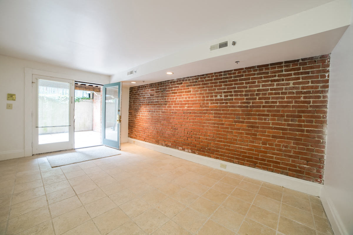 Living Area with Exposed Brick at Lockerbie Court on Mass Ave, Indianapolis