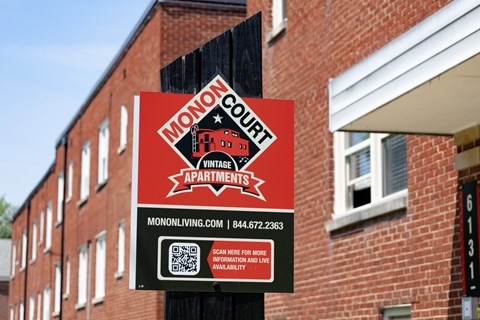 Leasing signage for Monon Court Apartments Broad Ripple highlighting vintage one- and two-bedroom apartments near Monon Trail access.