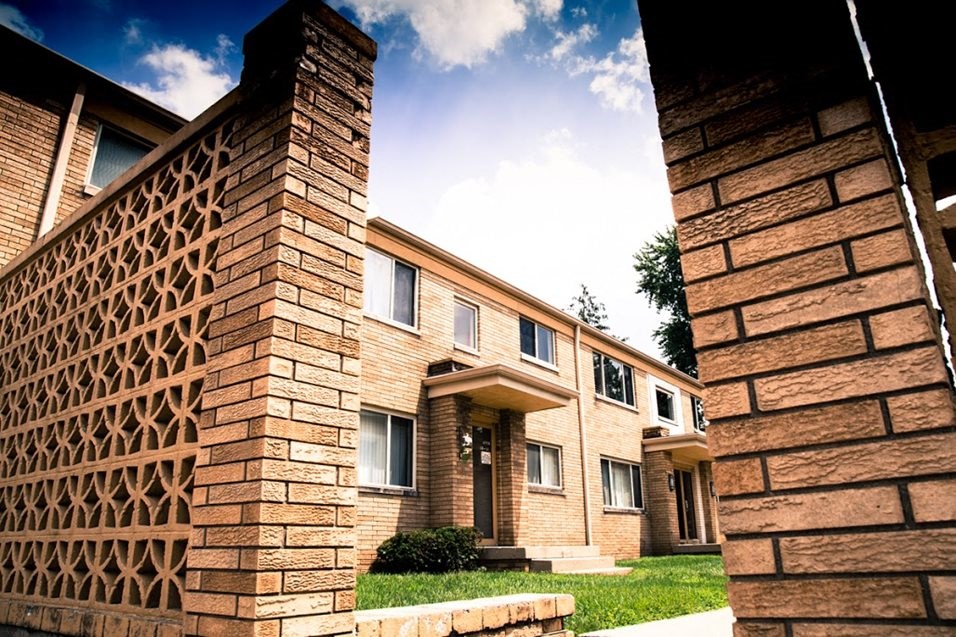 a view of a brick building with a blue sky in the background