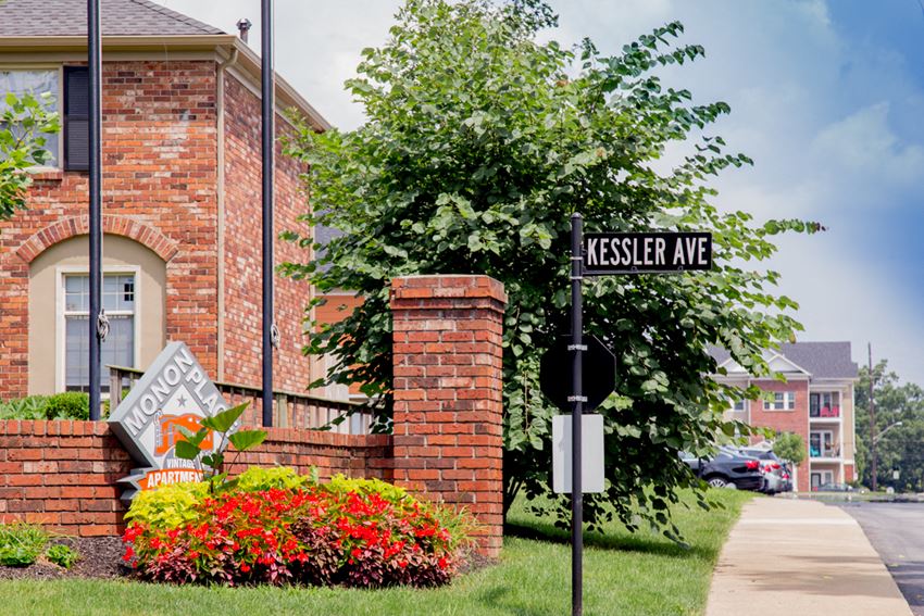 a street sign in front of a brick building